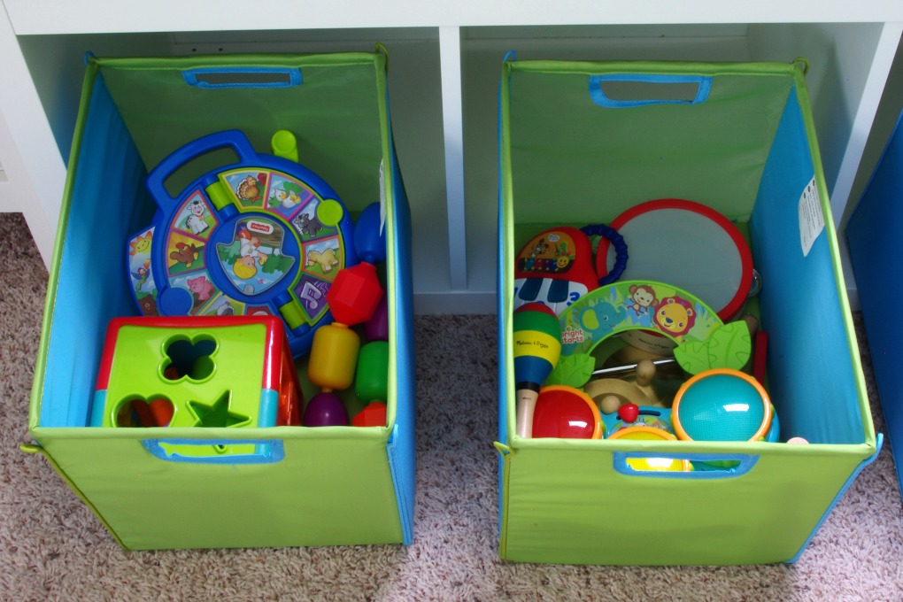 We made the bench seat in our playroom more functional. It is organized in a way that makes the most of the space we have! | #organization #organizing #storage #storagebins #organized #kallax #playroom