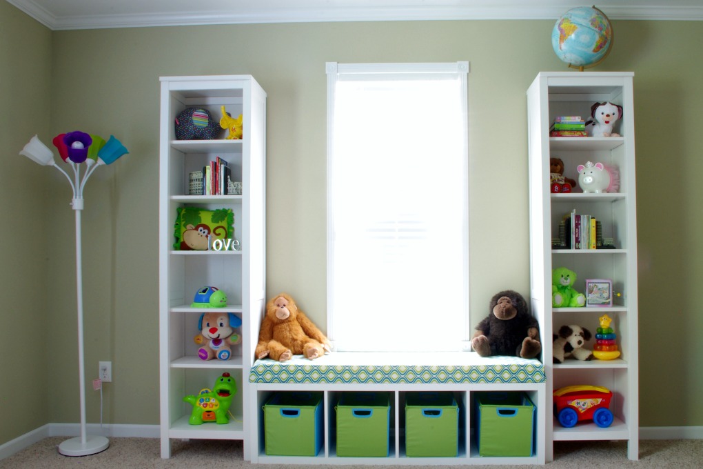 We made the bench seat in our playroom more functional. It is organized in a way that makes the most of the space we have! | #organization #organizing #storage #storagebins #organized #kallax #playroom