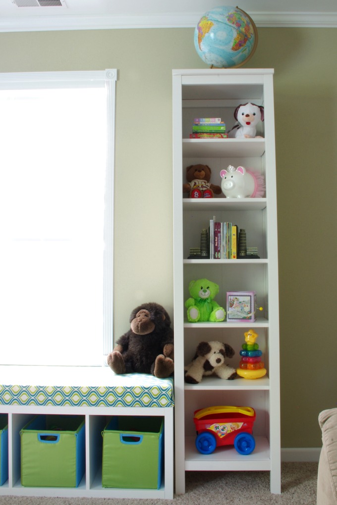 We made the bench seat in our playroom more functional. It is organized in a way that makes the most of the space we have! | #organization #organizing #storage #storagebins #organized #kallax #playroom