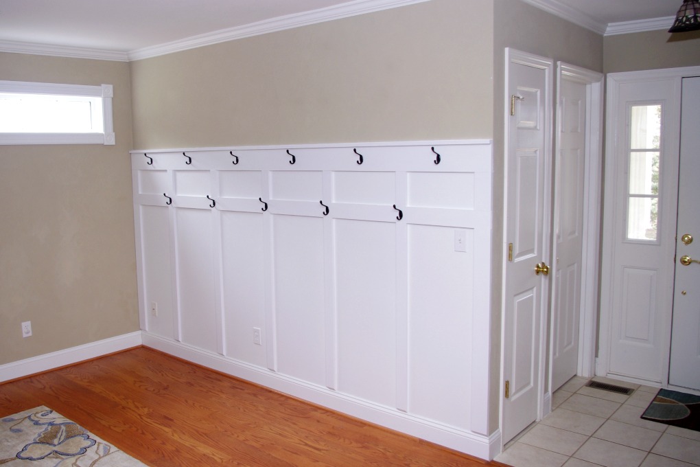 We added a board and batten treatment to the entryway wall in our house. With 11 hooks, it adds a lot more storage area for us! | #boardandbatten #entryway #organization #organizing #wall #funandfunctionalblog