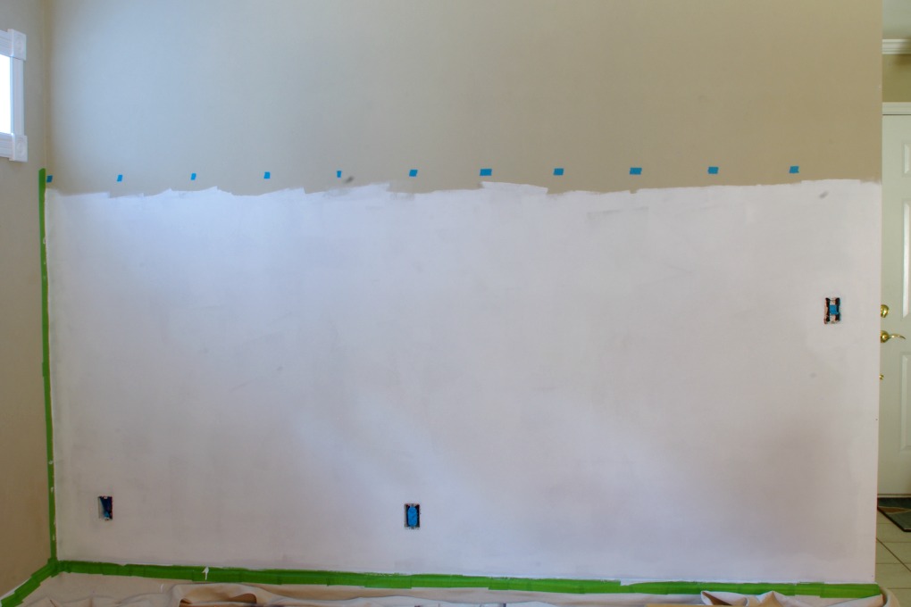 We added a board and batten treatment to the entryway wall in our house. With 11 hooks, it adds a lot more storage area for us! | #boardandbatten #entryway #organization #organizing #wall #funandfunctionalblog